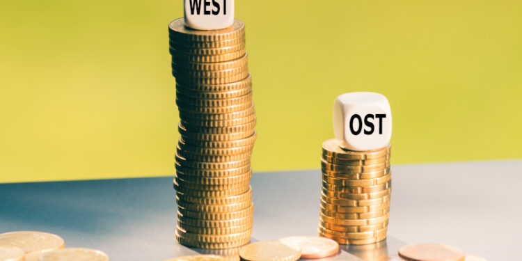 Symbol für den Lohnunterschied zwischen West- und Ostdeutschland.